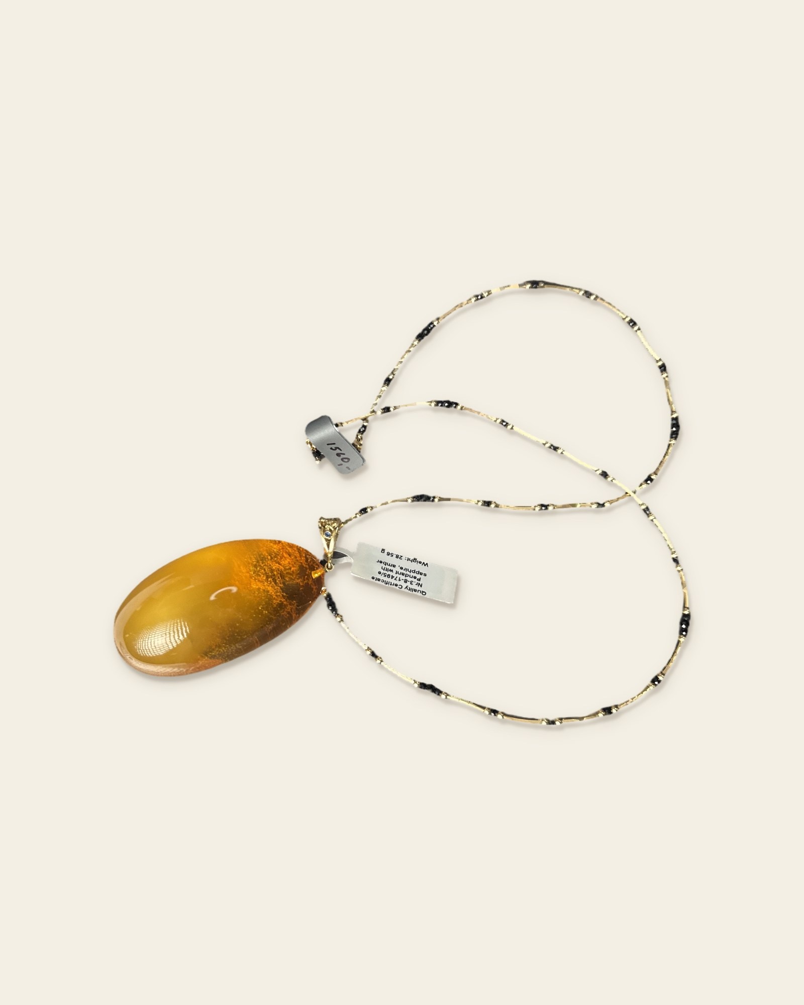 Vakars Necklace · Cognac Amber with Sapphire